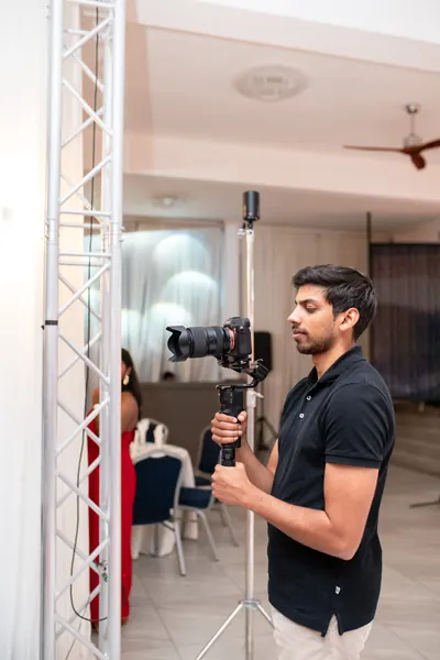 Videographer filming professional camera tripod, Mauritius