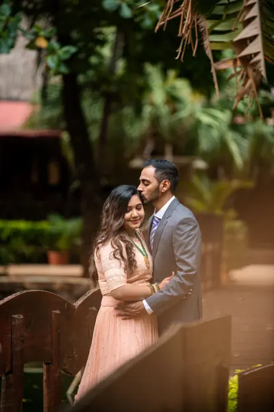 Couple embracing among lush tropical, Mauritius