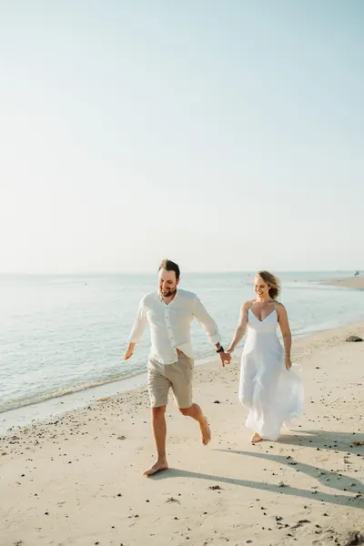 Couple walking together along tropical, Mauritius