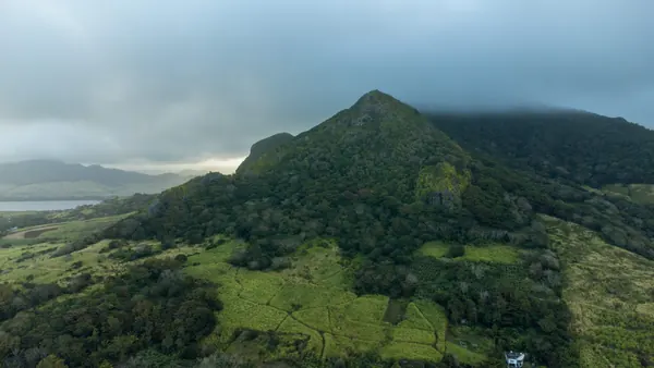 Aerial view misty mountains valleys, Mauritius