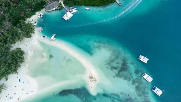 Aerial view turquoise lagoon anchored, Mauritius