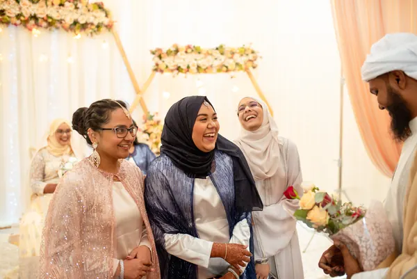 Guests smiling mingling indoor celebration, Mauritius