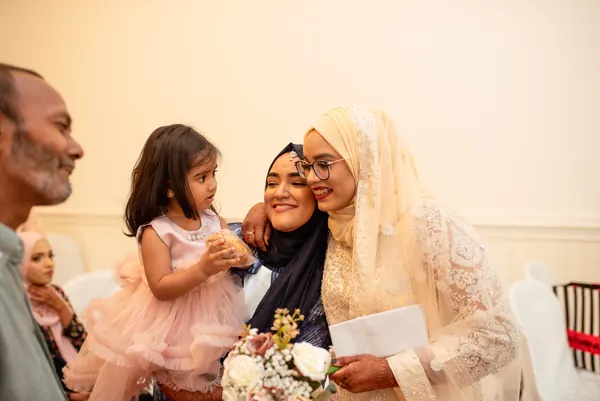 Multi generational family gathering indoors, Mauritius