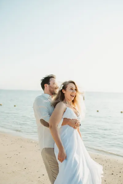 Bride groom embracing joyfully tropical, Mauritius