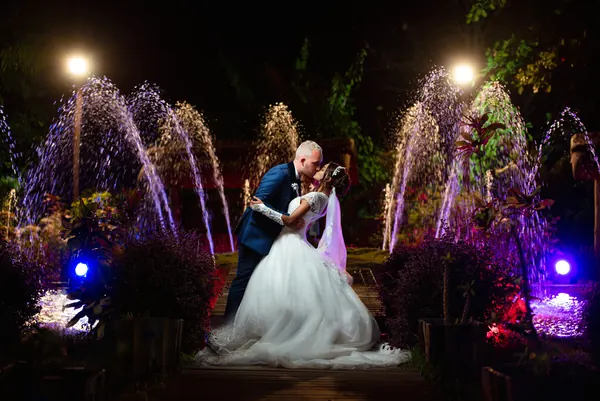 Bride groom kissing deck lit, Mauritius